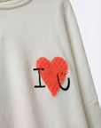 Hoodie mit Bouclé‑Herz creme, One Size