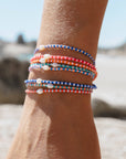 Perlenarmband Mutiara türkis-orange